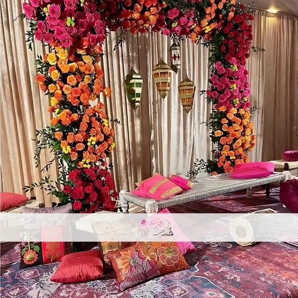 Vibrant Floral Mehndi Stage with Traditional Seating
